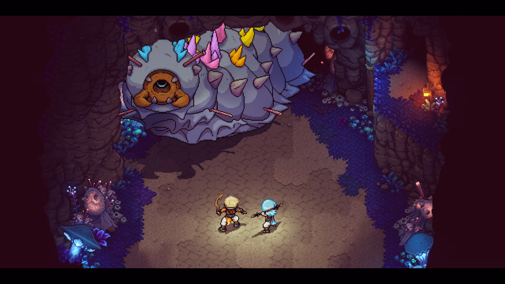 A giant gem-encrusted slug looms over the party.